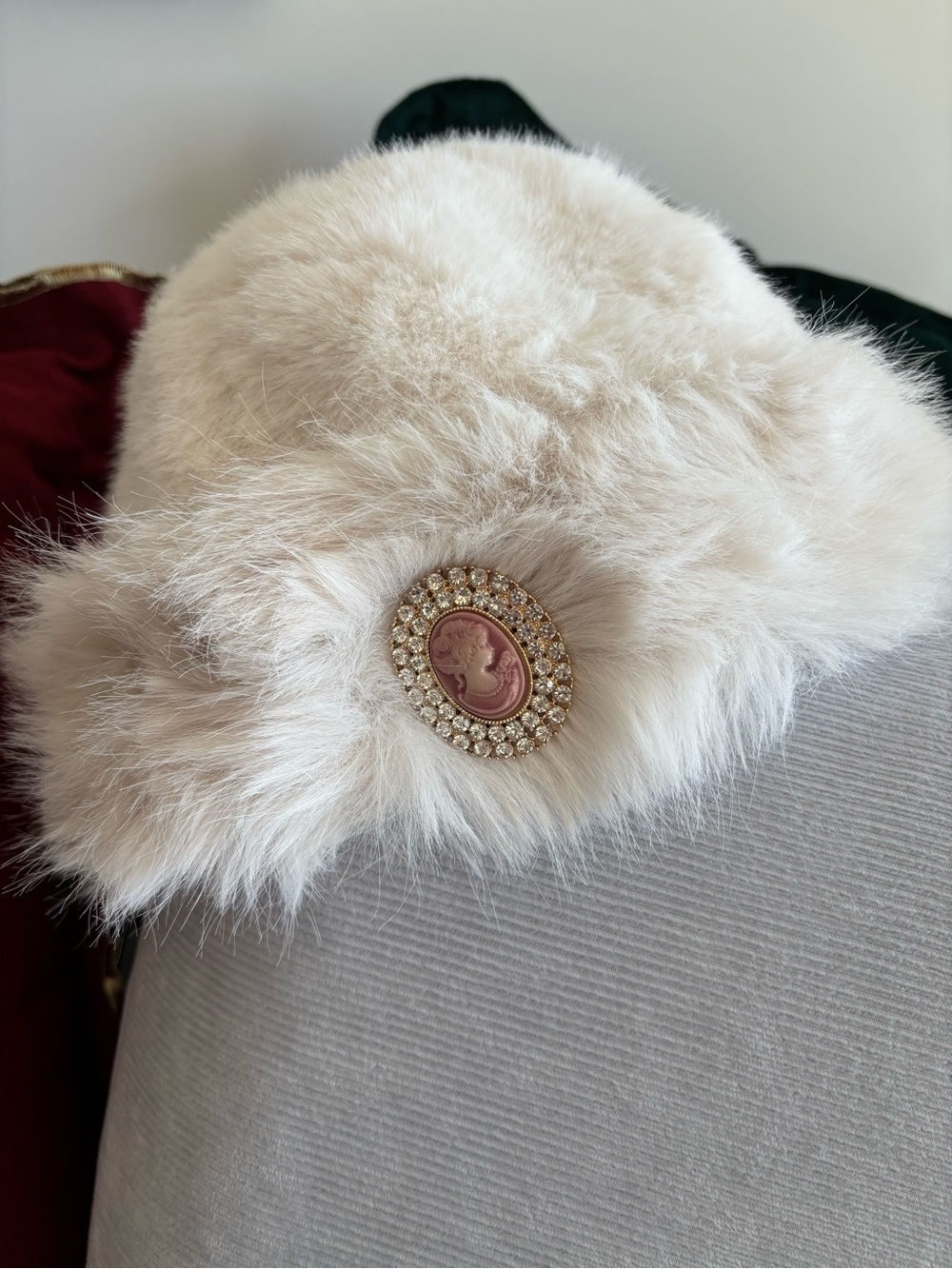 Elegant Cream Faux Fur Hat with Cameo Brooch